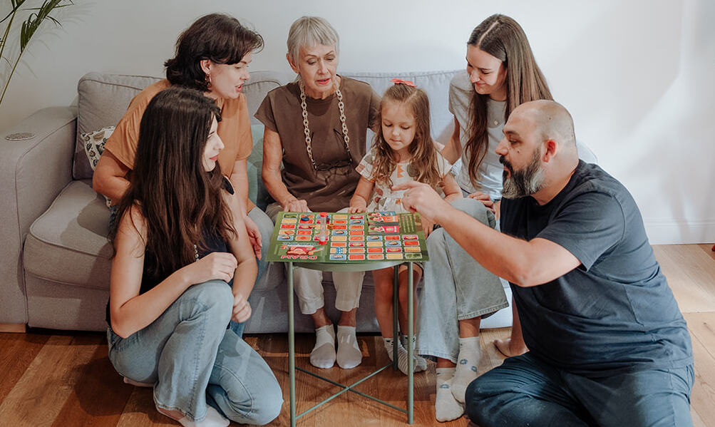 A young girl enjoying Draw Close with her family